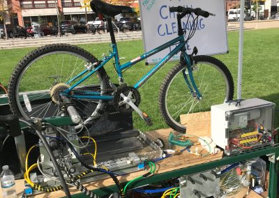 The VonBuckinator™ cleaning and lubricating a bike chain